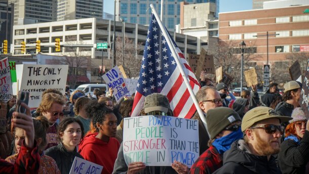 A protestor holds up a sign during a Salt Lake City "National Shutdown" march against U.S. Immigration and Customs Enforcement, Jan. 30 2026.