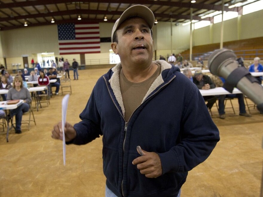 <p>Migrant worker Felipe Chacoa of Mexico talks about his desire to continue to harvest produce during a meeting of farmers and state officials to discuss the impact of the Alabama Immigration law on their livelihoods in Oneonta, Ala.</p>