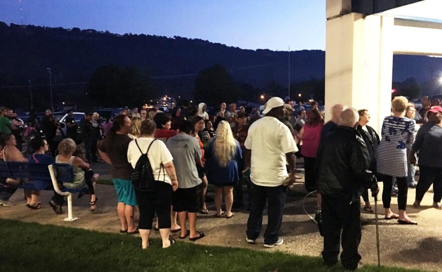 About 100 people slept in their cars overnight in the Red Bank High School parking lot waiting to receive medical care in Chattanooga, Tenn.