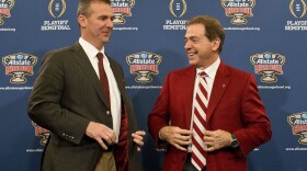 FILE - Ohio State coach Urban Meyer, left, and Alabama coach Nick Saban laugh during a news conference at the Marriott downtown convention center in New Orleans, Dec. 31, 2014. Saban and Meyer are up for election to the College Football Hall of Fame for the first time. (AP Photo/Brynn Anderson, file)