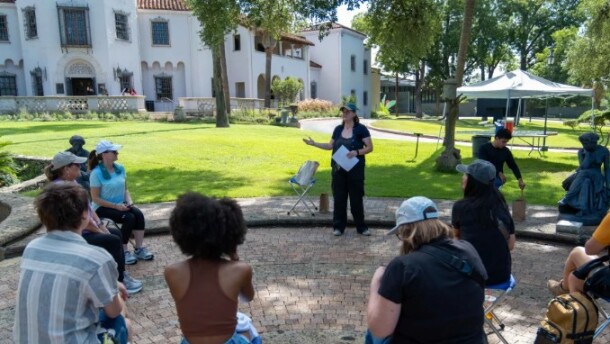 A gathering on the front lawn at the McNay
