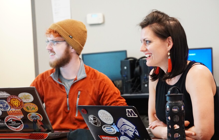 SLU students Brian Heneghan and Lillian Jones watch a video game demonstration in Intensive Italian for Gamers.