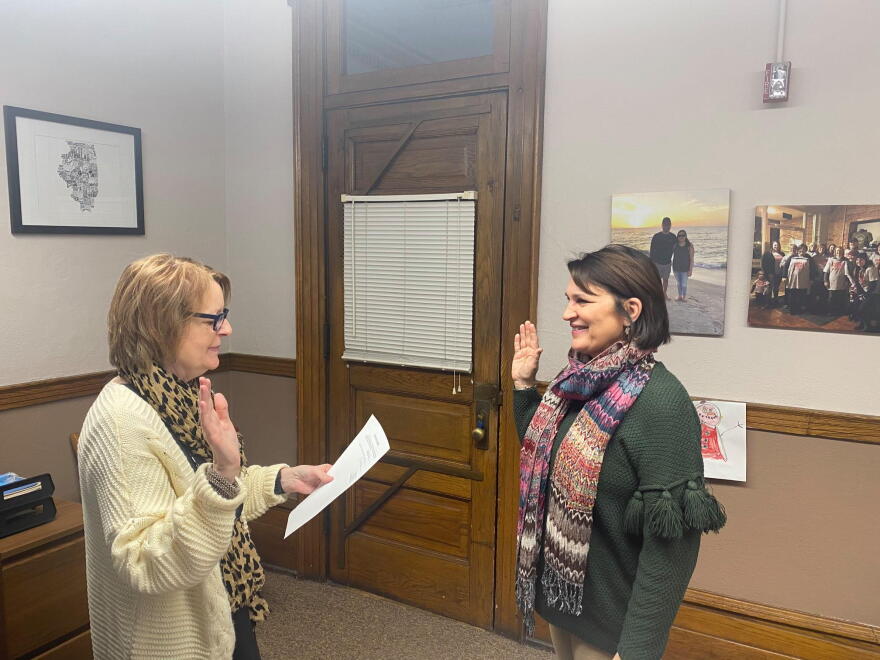 State Sen. Sally Turner (pictured right) is sworn into office Monday by Logan County Clerk Theresa Moore. Turner served as clerk for the county for 24 years.