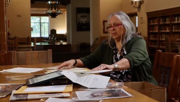 Zonnie Gorman sorts through Code Talker archival material she's collected in Zimmerman Library at the University of New Mexico on July 29, 2026.