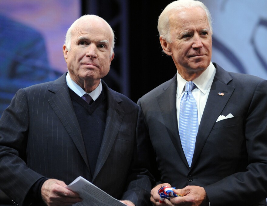 Sen. John McCain, R-Ariz., receives the Liberty Medal from former Vice President Joe Biden (right) in October 2017. Biden is one of many pallbearers who will serve at ceremonies honoring McCain this week.
