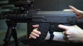 A weapon is used on the indoor firing range at the National Armory gun store in Pompano Beach, Fla., in April.
