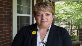 Dr. Michelle Fiscus stands outside her Franklin home, days after the health department fired her.