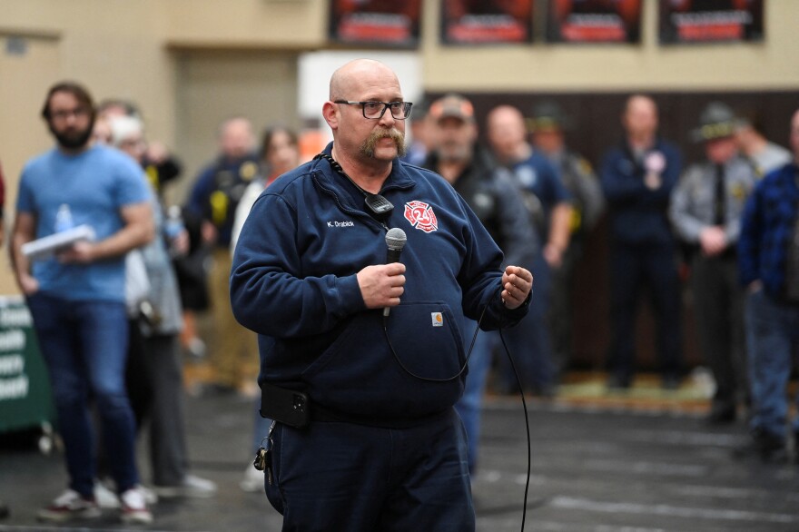 East Palestine Fire Chief Keith Drabick speaks with community members about safety concerns at a town hall meeting on Feb. 15.