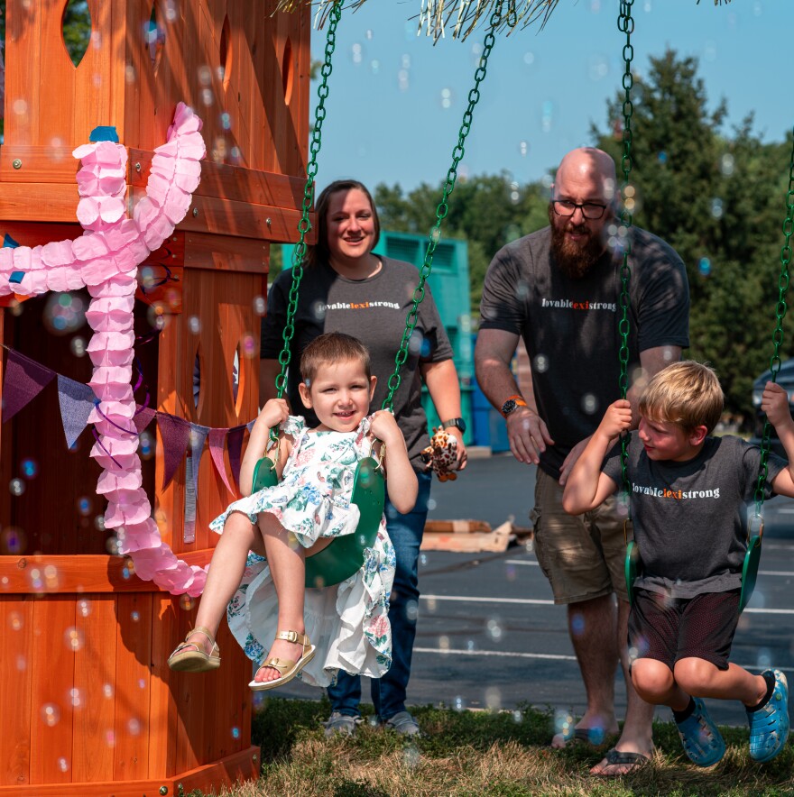 Springfield child Lexi enjoys playtime with her siblings and parents on play equipment donated by a Springfield, Mo. company in August, 2026.
