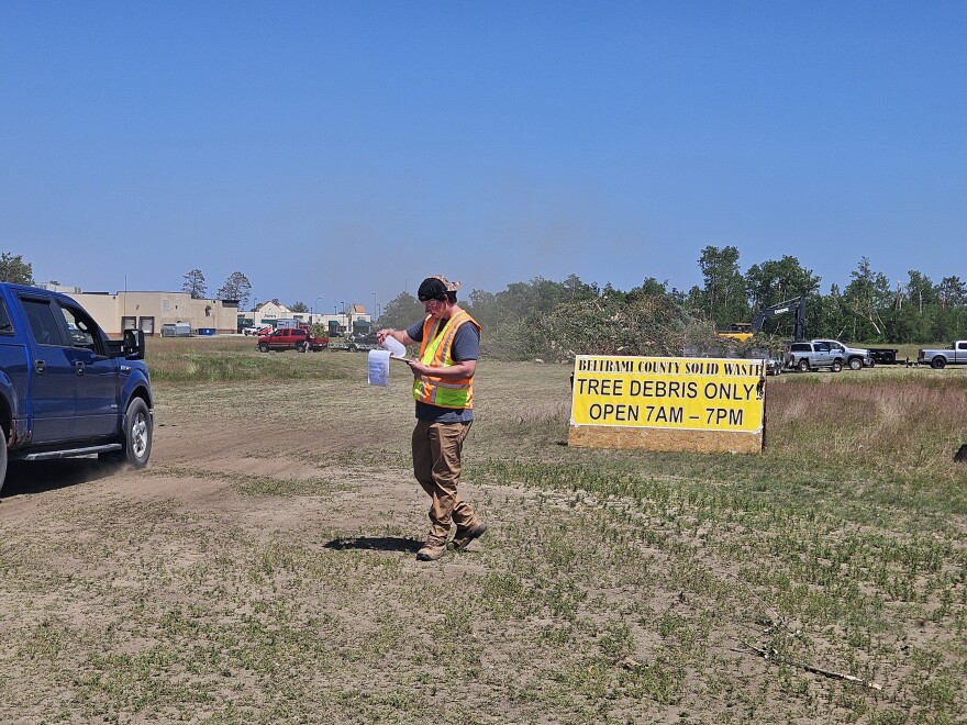 The temporary tree debris site behind Bemidji's Target is a busy site of activity with dump trailers moving storm debris on June 24, 2025.