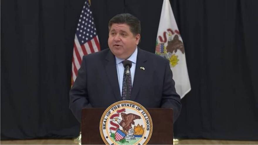 Gov. J.B. Pritzker speaks at a mass vaccination site at Shabbona Middle School in Morris on Thursday, March 11. The governor announced a new plan to relax more COVID restrictions in Illinois on Thursday. 