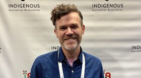 Kaleb Roedel held his award at the Indigenous Journalists Association (IJA) Indigenous Media Awards Banquet on Friday, July 24, 2026.