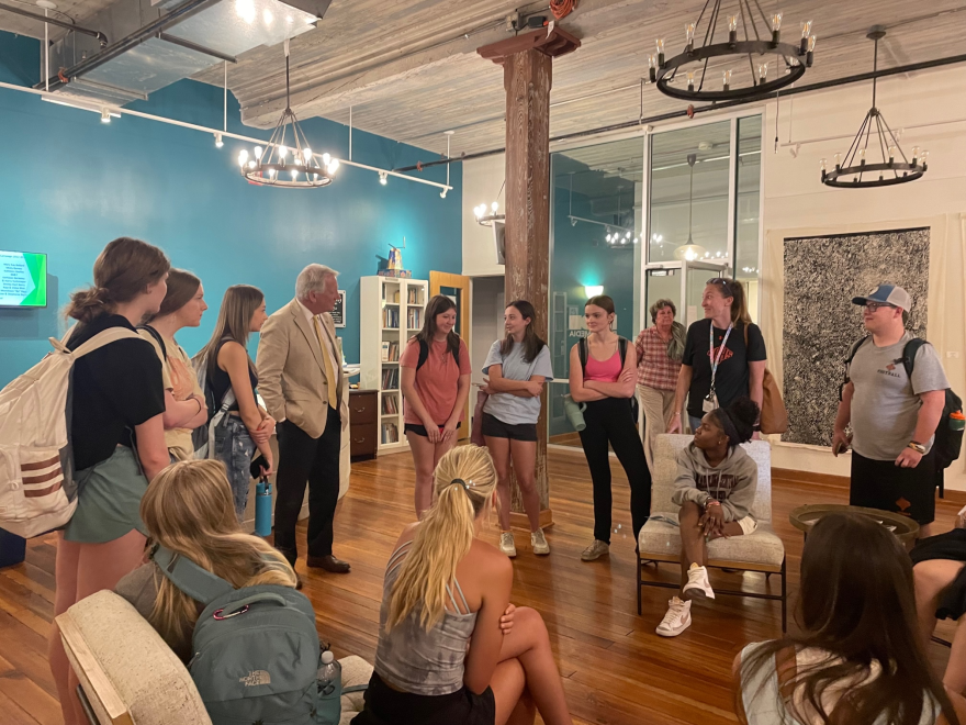 New Hanover High students visit the WHQR studio. HQR Board Member Rob Zapple (on left) ran into the students while they were visiting on May 10. Kylee Maarschalk pictured right, sitting in front of her is Myonna Harry.