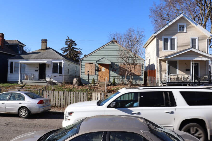 Vacant homes boarded up along Warren Avenue on Columbus' West Side.