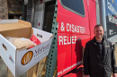 Midwest Food Bank Morton Executive Director John Cirilli and one of the charity's relief packages