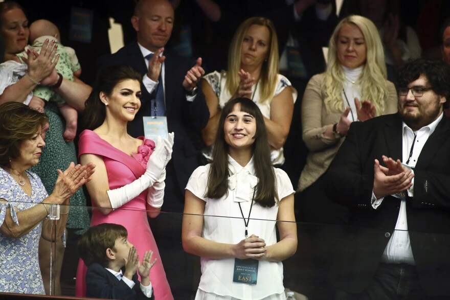 Chloe Cole, center, is recognized by Florida Gov. Ron DeSantis during a joint session for his State of the State speech Tuesday, Mar. 7, 2023 at the Capitol in Tallahassee, Fla. At left, is Florida first lady Casey DeSantis.