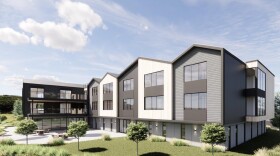 A computer rendering of a residential black, white and grey building