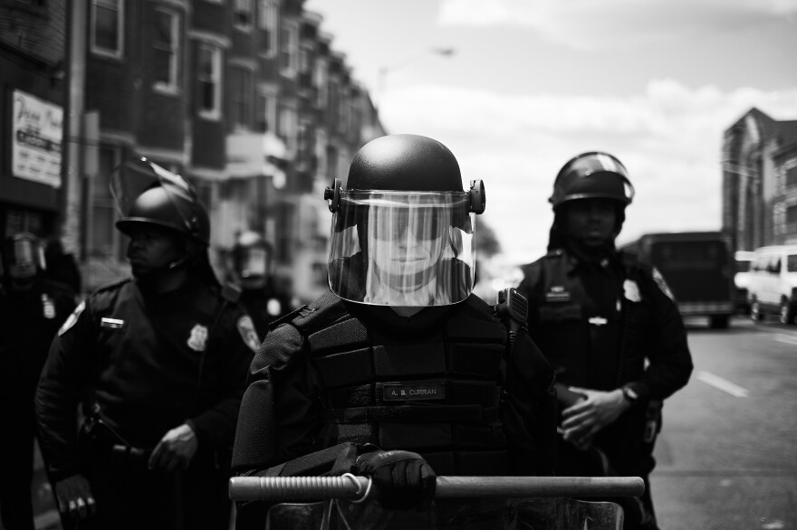 Police and National Guard officers block off Pennsylvania Avenue during protests over Freddie Gray's death in Baltimore, Md., in 2015.