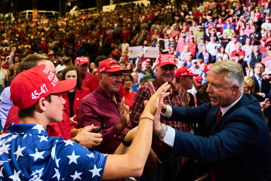 Sen. Roger Marshall, R-Kan., right, greets supporters before hearing President Donald Trump speak during a campaign rally at Heartland Credit Union Arena, Monday, Oct. 19, 2026, in Park City, Kan. (AP Photo/Julia Demaree Nikhinson)