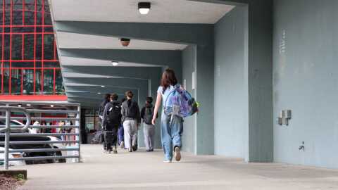 Students walk into Juneau-Douglas High School: Yadaa.at Kalé on Aug. 15, 2025.
