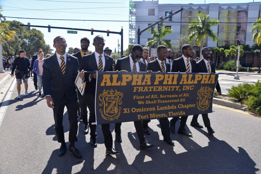 Members of the Alpha Phi Alpha fraternity lead the Martin Luther King Jr. Day commemorative march in downtown Fort Myers.