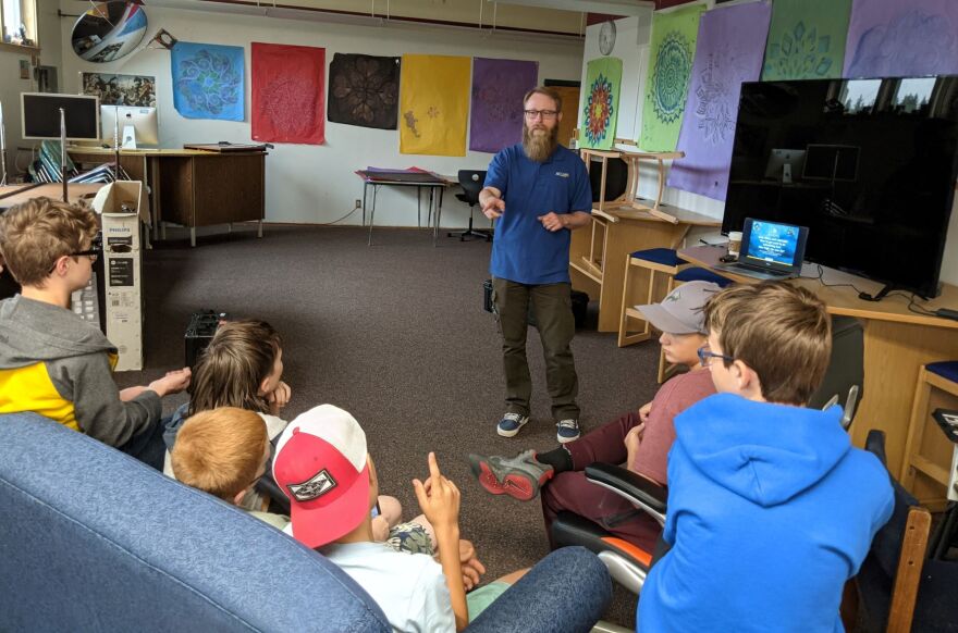 Adkins has talked about drone-aircraft systems to many groups of young people statewide like these in the Delta Junior High library.