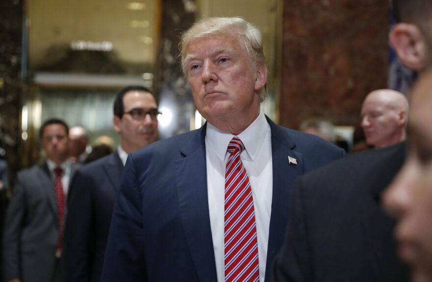 President Donald Trump stops to listens to questions from members of the media in the lobby of Trump Tower, Tuesday, Aug. 15, 2017 in New York. (Pablo Martinez Monsivais/AP)