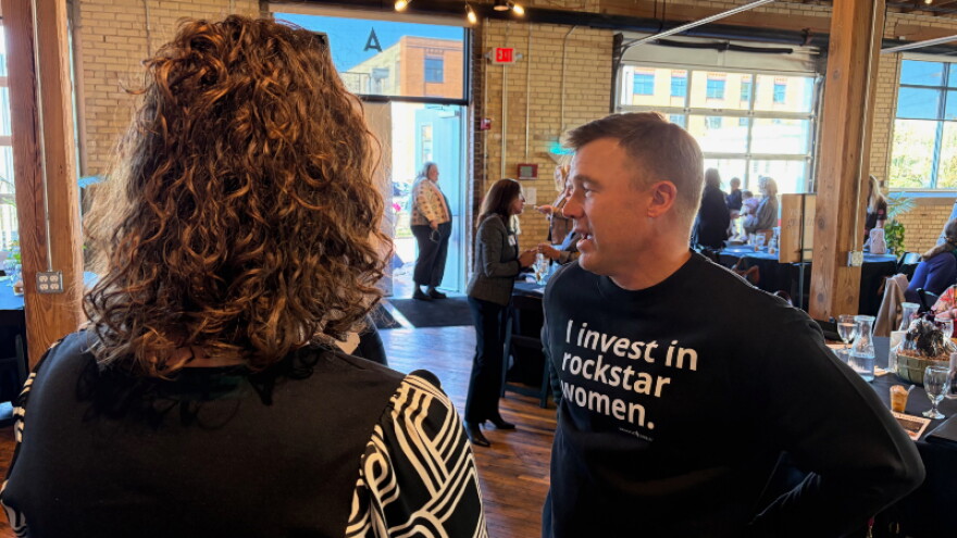 Steve Jandernoa with 42 North Partners (right) speaks with an event attendee.
