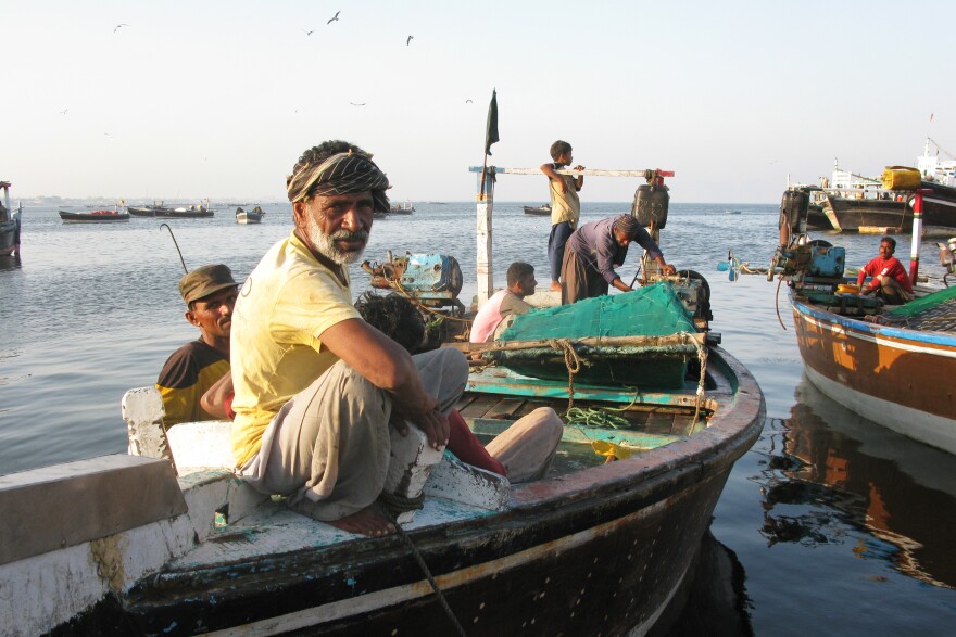 A Gwadar fisherman relaxes as the sun goes down.