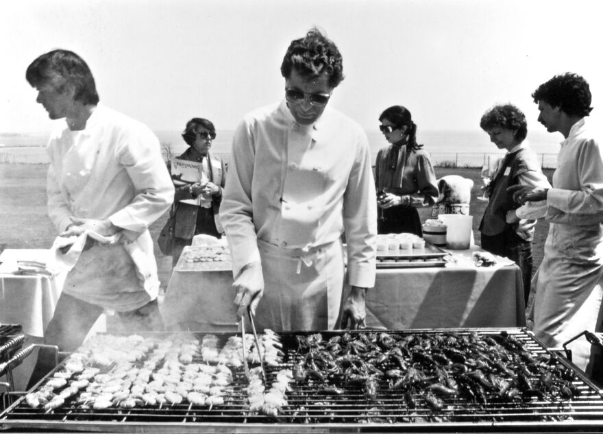 Jeremiah Tower <a href="http://www.csmonitor.com/1983/0518/051807.html">grills lunch</a> for 100 food journalists on the lawn of the Astor mansion in Newport Beach, R.I., in 1983. Tower wowed the East Coasters with his "new California" or new American cooking.