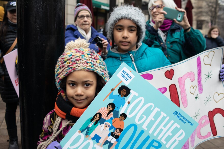 Sisters Lizzie and Helen Greene attend the Women's March in D.C. with their parents.