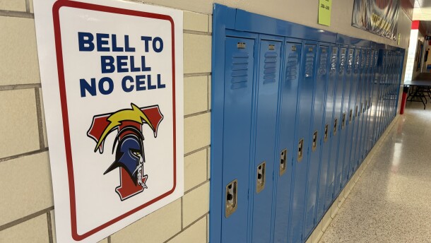 A sign at Wichita South High School reads "Bell to Bell No Cell," reminding students not to use their phones during the school day. A new state law bans student cell phone use in K-12 schools.