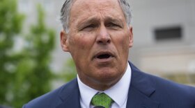 Gov. Jay Inslee, shown here at the Federal Detention Center in SeaTac in June, has traveled on behalf of the Democratic Governors Association more than a dozen times in 2018. 