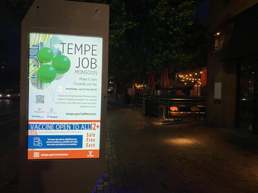 lighted kiosk at night highlights job fair