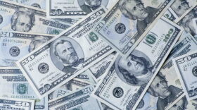A picture of American currency spread around.