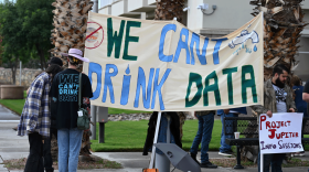 Protesters gathered outside a Sept. 19 Doña Ana Board of County Commissioners meeting to urge elected officials to vote against the $165 billion bond for the massive data center project known as Project Jupiter. (Leah Romero for Source NM)