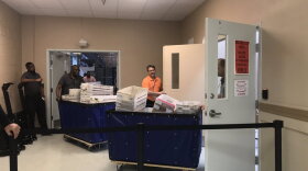 Three cart loads of ballots are brought into the Broward Elections office for the canvassing board to examine on Thursday, Nov. 8, 2018.