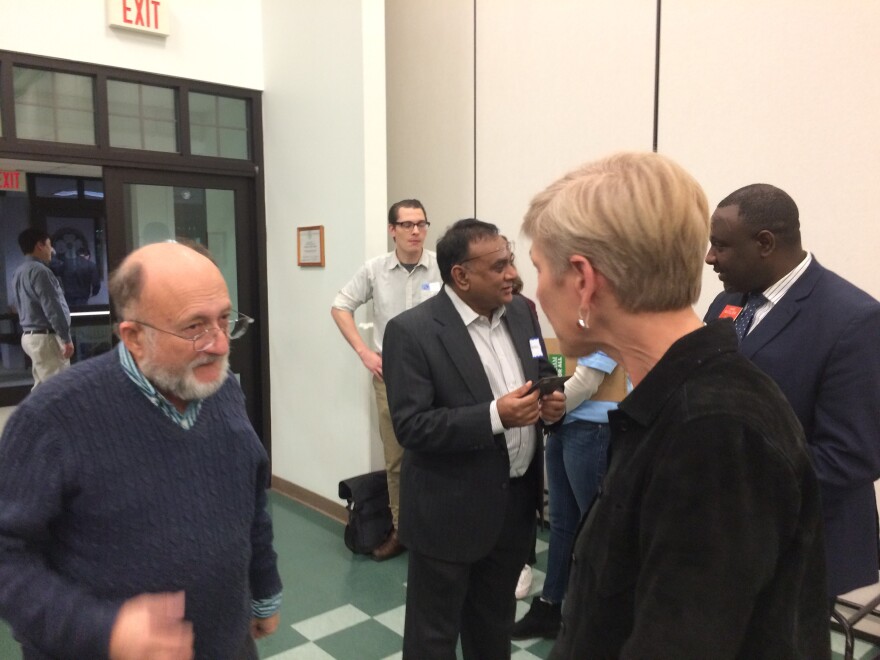 Robert Hyman, 72, left, talks with Deborah Ross, at the Western Wake Dems Candidate Forum, in Cary, on Jan. 28, 2020. She is one of the four candidates seeking the Democratic Party nomination in North Carolina's 2nd Congressional District.