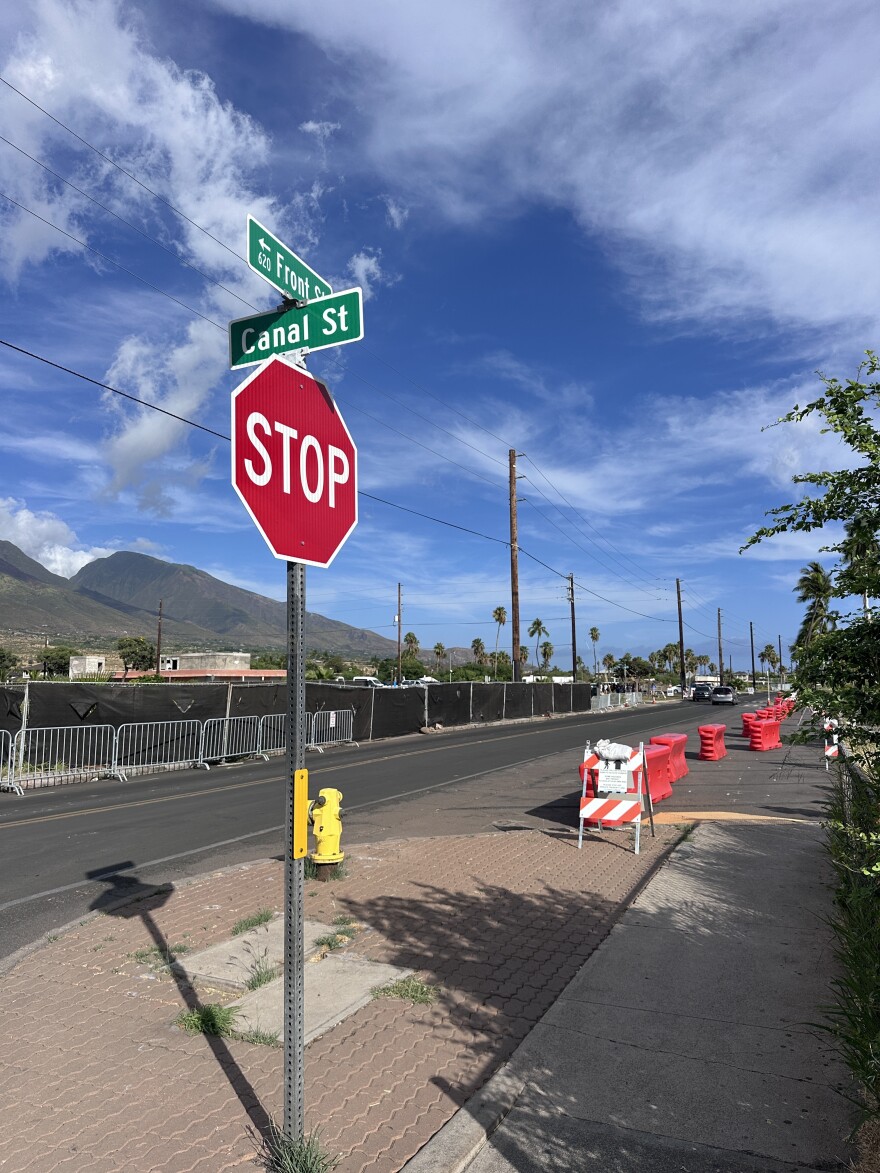 Barricades and fences still direct traffic and pedestrians in Lahaina as rebuilding and recovery efforts continue, seen here on July 31, 2026.