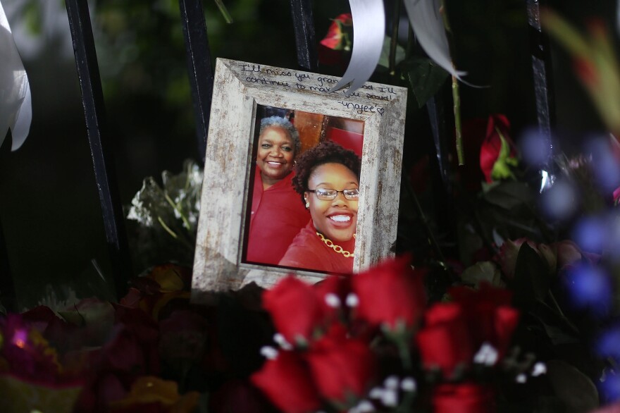 A family photograph among the memorials on the sidewalk in front of the Emanuel African Methodist Episcopal Church in Charleston, S.C., after a racially motivated mass shooting there on June 20.