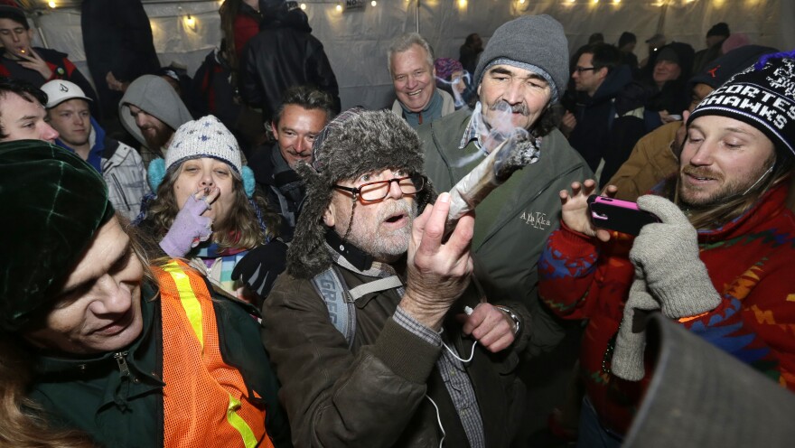 Partiers celebrate marijuana legalization in Washington state at a pot party in Seattle earlier this month.