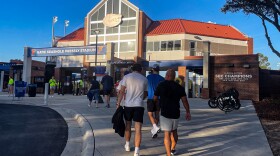 Fans enter Katie Seashole Pressly Softball Stadium ahead of a UF softball game. The price to attend athletics events may increase for fans depending on the university’s decisions. (Hannah Getman/WUFT News)
