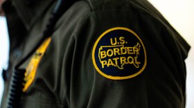 FILE - A U.S Border Patrol badge is displayed as Gregory Bovino, chief patrol agent of the U.S. Border Patrol's El Centro Sector, stands in a conference room before an interview with The Associated Press in Los Angeles, Aug. 25, 2025.