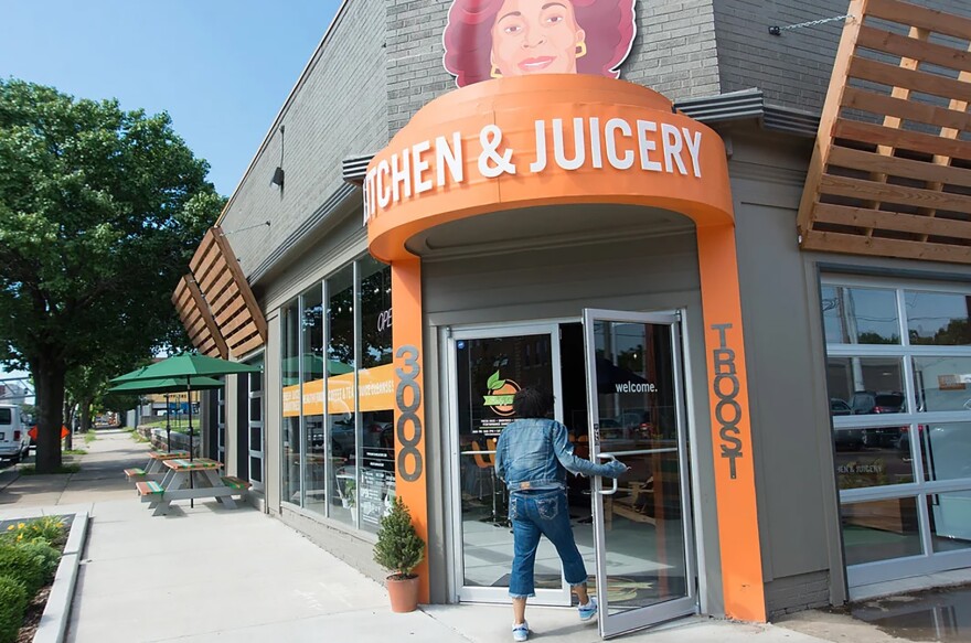 A person enters the doorway to Ruby Jean's Kitchen & Juicery on Troost Ave.