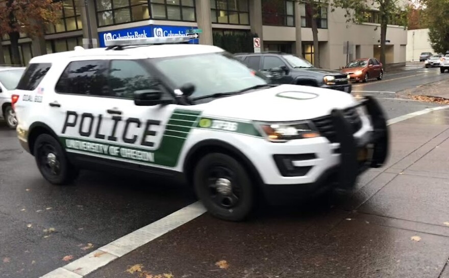 A University of Oregon vehicle drives through Eugene.