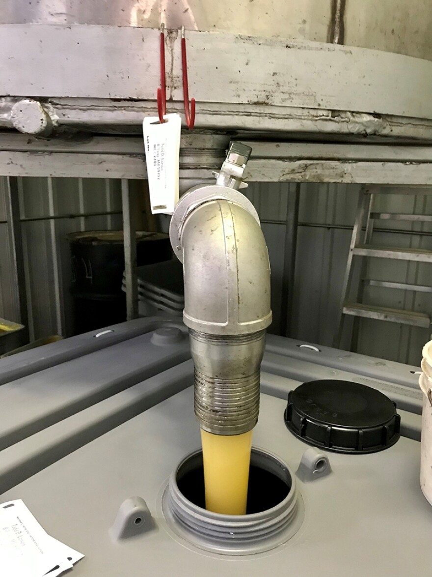 Honey pouring into a fiberglass tote at Larson Apiaries to ship to the Sioux Honey Association Cooperative facility in Anaheim, CA