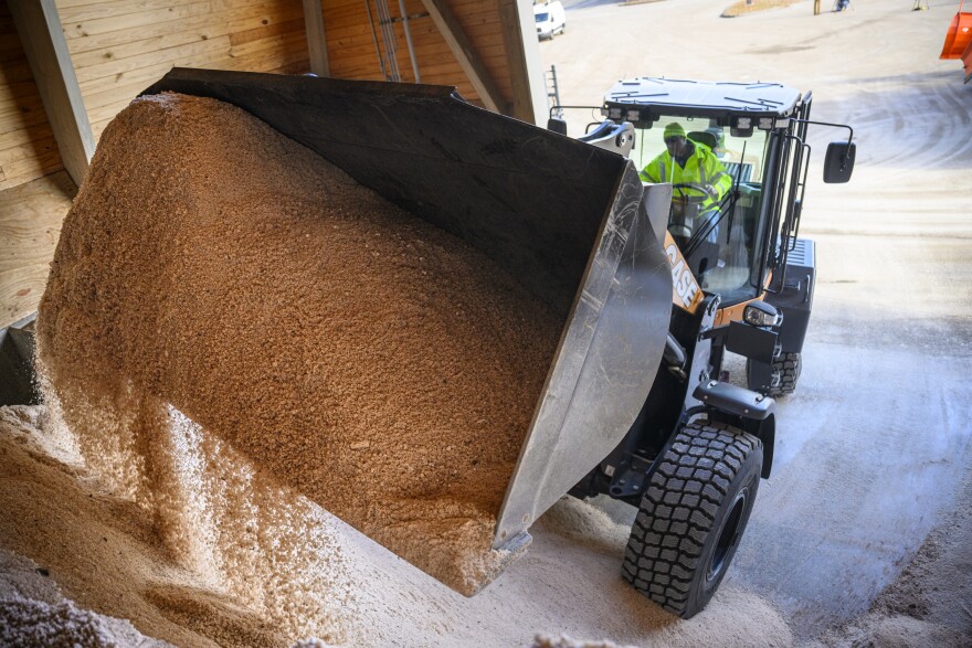 Loader operator Maury Menard pulls road salt from its storage shed while loading a plow at the at the Connecticut Department of Transportation Wethersfield Maintenance Service Center, January 05, 2024. A storm moving toward the area is expected to drop five to 12 inches of snow starting Saturday and continuing into Sunday.