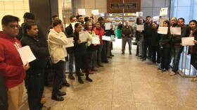 More than a dozen people protested at the meeting where the city-County Council voted 25-0 in an ordinance that would identify high-crime hotels.