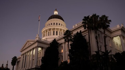 The lights of the state Capitol glow into the night in Sacramento, Calif., Wednesday, Aug. 31, 2022.