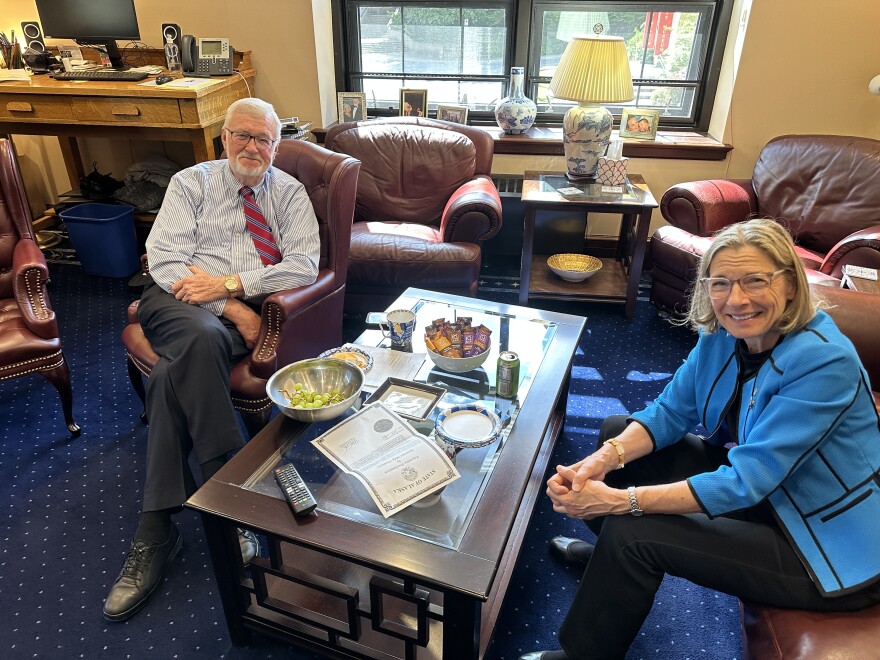 Senate President Gary Stevens, a Kodiak Republican, and Senate Majority Leader Cathy Giessel, an Anchorage Republican, sit in Stevens' office watching the House floor debate with a copy of the